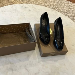 Black patent peep toe wedges with snake skin detail heel.